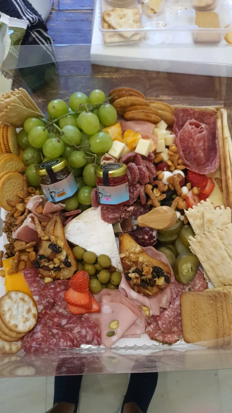 Large charcuterie board featuring Mama Sassy products